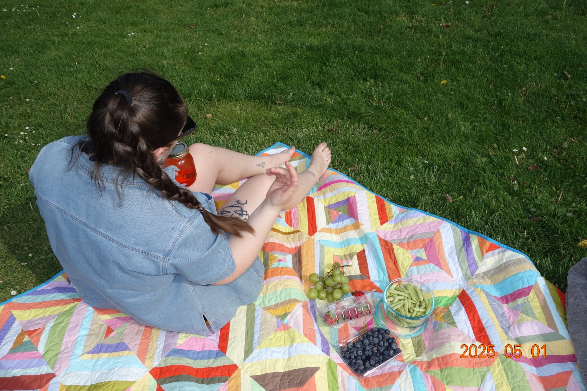 A picnic blanket on the grass — restful, low-pressure movement outdoors
